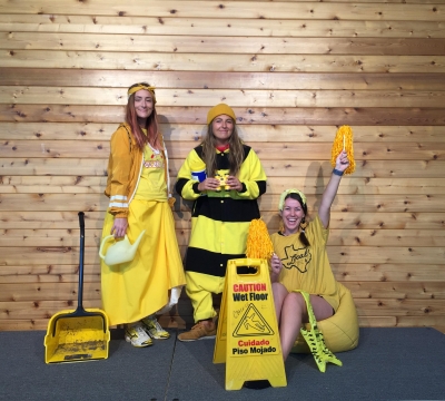 Amanda, Amelia, and Carleigh are dressed in different types of yellow costumes and clothing with yellow props to pull together a monochromatic portrait.