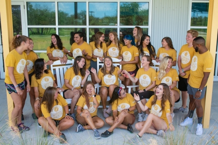 2019 Activity Leaders and Programming Team laugh for silly group photo in yellow camp shirts
Photo by: Beyond Memory Photography